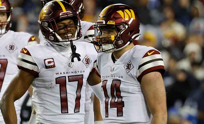 Washington Commanders quarterback Sam Howell (14) and receiver Terry McLaurin (17) celebrate a play in Week 18.